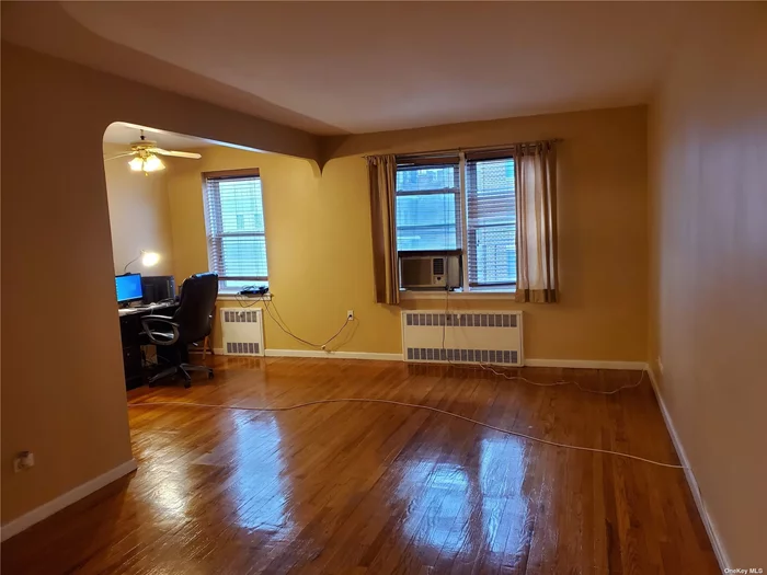 Bright, Sunny & Spacious Studio, Updated, Excellent move-in condition, it offers Spacious living area and Windowed bath, hardwood floors. Located in the Heart of Kew Gardens convenient to E AND F express train, as well as buses, Long Island railroad and ALL Shopping!!!.