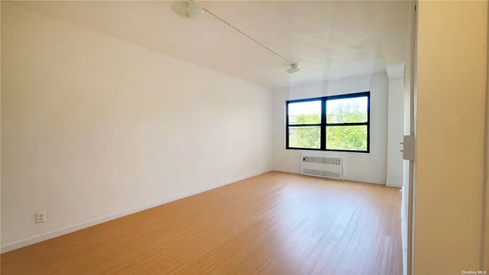 Sun Drenched Move in Ready Spacious Studio in The Heart of Rego Park. Oversized Windows. New Kitchen & Appliances, Quarts Countertop, New Floors, Updated Bathroom. Fireproof/Soundproof Building, Renovated Lobby With Handicap Access/ Sliding Door. Live-In Super, Laundry at Lobby Level. Maintenance Includes All Utilities. Close to Parks, Schools, Trains, Restaurants, Shopping. Outdoor/Indoor Parking Available. Only $1000 Flip Tax, Pet Friendly. Can be sublet after 2 years.