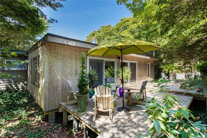 Mid Century dream on sought after Midway Walk. Extra deep lot offers unparalleled privacy only a short distance from the harbor. Wraparound outdoor decking leads to n extraordinary lanai and an extra large lap pool. Primary bedroom with ensuite bath, second guest bedroom currently set up as cozy pool facing family room.