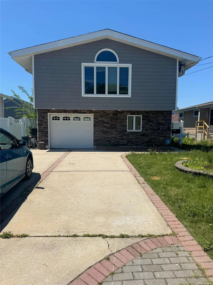 Beautiful renovated house on oversized property.New bathroom and floors.3 bedroom with 1 bath, living room and dinning room on 2nd floor, 1st floor offers spacious family room with beautiful bedroom, garage , utilities and full bath.walk distance from water.ALL BEDROOMS ARE GOOD SIZED.