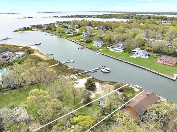 Rare opportunity to own a home on Wells Creek! This is a boater&rsquo;s dream with quick access to Shinnecock Bay and to the inlet to catch those stripers! It&rsquo;s only minutes to the water from the backyard dock where there&rsquo;s room for 2 boats up to 20 feet, or other water toys! This south of Montauk Hwy location offers quick access to hamlet shopping, dining, and the beaches on Dune Road and on the bays. This 3 bedroom, 1.5 bath cottage can with gorgeous great room can be your summer refuge and retreat in the fabulous Hamptons. You have found your paradise!