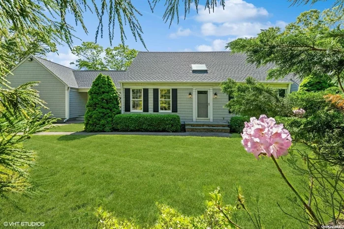Nestled between preserved farmland of Cutchogue and New Suffolk beaches, this custom-built home is back on the market and ready for summer. Set back off New Suffolk Ave. on a private road. All new HVAC mechanicals, new roof, new decking, full house generator on gas. First floor primary suite! 2 Large upstairs bedrooms. Possible 4th bedroom. No flood zone. Huge first floor primary bedroom has en suite marble bathroom featuring radiant heat floors and vaulted ceilings. Kitchen with GE Appliances opens out to trex deck perfect for entertaining. Cozy up year round by the wood burning fireplace, work from home space in private office with custom built-in cabinets, first floor laundry room. Walk-out, dry basement, 2-car garage. Possible room for 20x40 pool with prior town approval. Meticulously maintained, this home is move in ready!