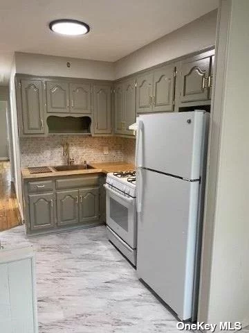 Welcome to this Renovated Legal 2 family w/ Finish Basement and Outside Entrance. Each Floor consist of 2 Bed 1 Bath, Living Room and Eat In Kitchen. Wood Floors Through Out, Back Yard, Attached Garage, Private Parking for 2 Cars.. Great Location Conveniently Located Near Shopping and Transportation.