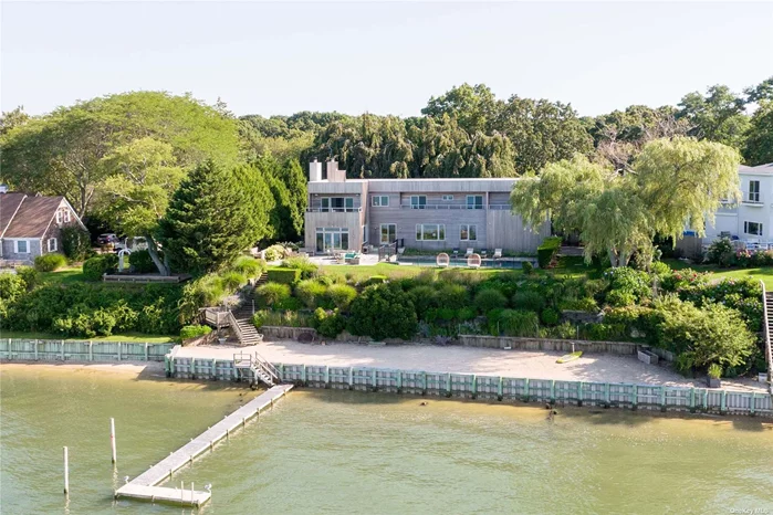Stunning waterfront modern with sweeping views of the Peconic Bay from every room. The 130&rsquo; of bay frontage is complimented by your 70&rsquo; dock, waterside gunite pool and five ensuite bedrooms overlooking the water. With soaring ceilings, a chef&rsquo;s kitchen, wood burning fireplace, and a dedicated teak balcony for each second-floor bedroom, the property blends the luxury vacation experience with the comforts of home.