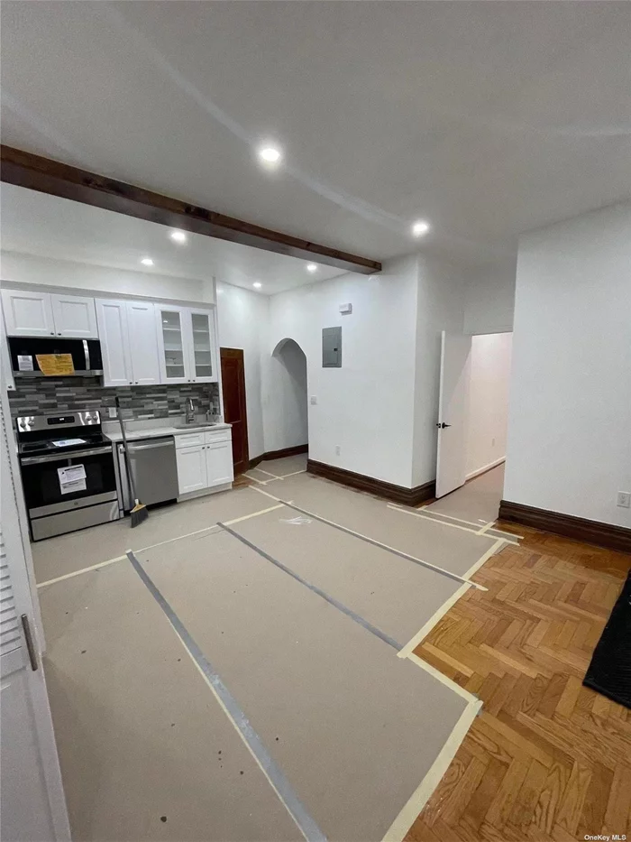 Renovated, modern two-bedroom apartment on 2nd floor in a multi-family home with washer/dryer, ceramic tiles, hardwood floor, and lots of closets. Near school and shopping and a brisk 4 min walk to the subway train.