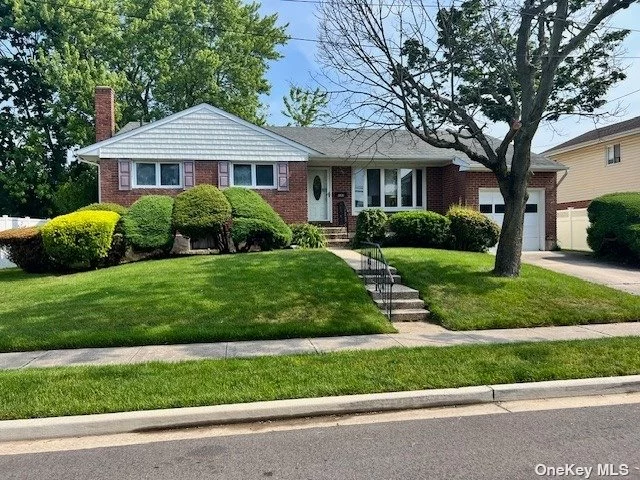 Lovely Ranch located on a quiet dead-end block in Farmingdale, Woodward Parkway area. Primary bedroom has 2 closets and a half bath, plus two additional bedrooms. Hardwood floors throughout. Gas heating and cooking, attached garage with entrance into the den. Vinyl fencing.