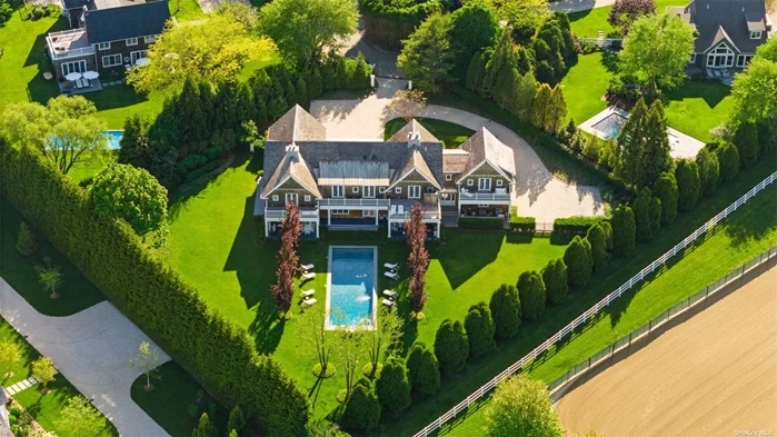 A luxurious haven nestled on a meticulously landscaped 1+/- acre lot in a serene cul-de-sac in Watermill. Surrounded by the natural beauty of Bridgehampton&rsquo;s horse country, this stunning and fully furnished property offers the epitome of refined living. Originally constructed in 2005 and meticulously remodeled and expanded in 2023, this estate boasts 9, 400 square feet of designer living space, perfectly crafted for modern luxury living. As you approach, the property&rsquo;s manicured grounds, greet you with an air of elegance. Situated on the edge of a reserve, the backdrop of mature landscape set the stage for a private and tranquil retreat. The focal point of outdoor entertainment is the brand new 55-foot long heated gunite pool, installed with a child proof electric cover, flanked by rows of Cooper Beech trees and expansive covered porch space spanning 1, 000 square feet. This outdoor oasis features a Viking kitchen and grill, ideal for al fresco dining, as well as a fire pit sitting area, perfect for gathering under the stars. Stepping inside, the double-height entrance foyer bathes the interiors in natural light, welcoming you into sun-drenched spaces designed for both relaxation and entertaining. The formal living room, adorned with French doors, seamlessly transitions to the outdoor sitting and dining area, offering picturesque views of the landscape and pool area. Adjacent, the large formal dining room sets the stage for elegant gatherings, while a powder room adds convenience for guests. Further down the wide hallway, an inviting library awaits, anchored by a wood-burning fireplace, creating a cozy ambiance for quiet moments. The heart of the home lies in the gourmet eat-in kitchen, equipped with state-of-the-art Viking, Sub-Zero, and Miele appliances, where culinary delights are prepared with ease. A generous mudroom, complete with a PetSafe Smartdoor, provides functionality for everyday living. Additionally, a spacious en-suite Junior Primary bedroom is conveniently located on the ground floor, offering flexibility and comfort for guests or multigenerational living. Ascending to the second floor, six en-suite bedrooms await, including two Primary suites positioned on opposite ends of the hallway. Each Primary suite boasts its own separate office area and private balcony, offering breathtaking views of the extensive backyard, horse stables, and vibrant sunsets. An outdoor shower, nestled on the guest wing balcony, provides a refreshing escape in harmony with nature. This smart home is outfitted with cutting-edge technology, including Sonos ceiling speakers, Lutron lighting, five different heating and cooling zones, and a Pet Smart Smartdoor, ensuring convenience and efficiency at your fingertips. Additional features include an attached two-car garage, a full house generator, a new septic system, and a sprinkler system, completing this unparalleled offering. Every detail has been thoughtfully curated. This property is offered fullly furnished.