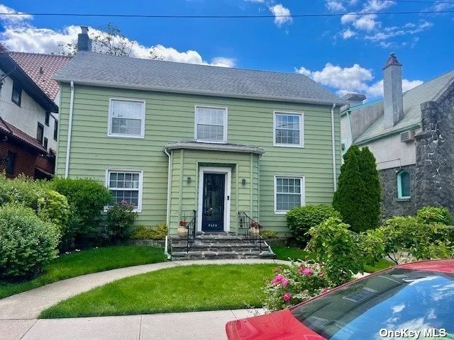 Remarkable Large Colonial Home. This home is set up perfect for Mother Daughter. 3 story home with many unique and lovely features. Living room w/fireplace, FDR, EIK, Wetbar, 1/2 bath on main part of first floor. 4 rooms plus 1 1/2 bathrooms are on the Right side of the First floor with sep entrance. 5 Bedrooms 2 Full Baths on 2nd floor and 3rd floor 1 Bedroom 1 Bathroom. Central AC for Main part of home. Hardwood floors, large spacious rooms. Private garden, 1.5 Detached Garage, Private Driveway. Steps from J Train, Buses, Walk to LIRR, 5 Blocks to Forest Park, 20 Min Car ride to Rockaway Beach.