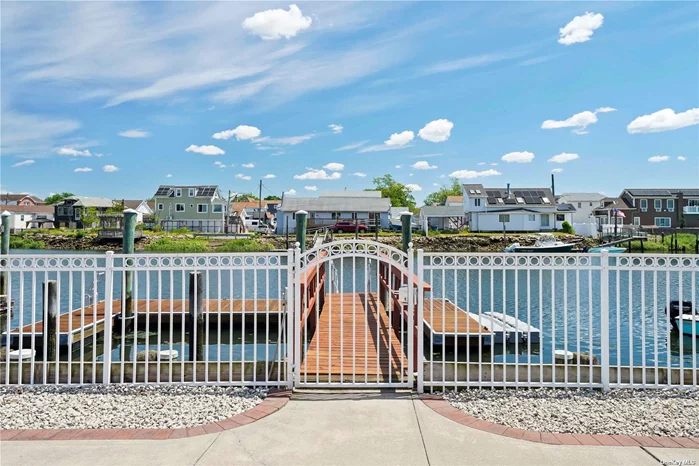 Welcome to your urban oasis! This beautiful, mother/daughter style waterfront home is nestled in the heart of New York City&rsquo;s Howard Beach neighborhood. This home offers the perfect blend of timeless elegance and modern convenience. Step inside and be greeted by warm, hardwood floors, a cozy electric fireplace, and abundant natural light. The eat-in-kitchen boasts granite countertops, sub-zero refrigerator, Bosch dishwasher, stainless-steel appliances, with a sliding glass door to the three-season sunroom which overlooks the massive backyard and serene waterfront. The sunroom features a wood burning stove for cool weather comfort. There&rsquo;s plenty of dock space for your boat, jet ski, fishing and crabbing for your enjoyment. The main floor living space also offers the comfort of central air, 3 large bedrooms, 2 full bathrooms, living room with electric fireplace, formal dining room, and home office. Upstairs you will find another living room, eat-in-kitchen, home office, 2 large bedrooms and full bathroom. There is a full basement with a washer/dryer, large garage with room for two cars, a long private driveway and inground sprinklers. This home has an elevation certificate and very low flood insurance. Welcome Home!