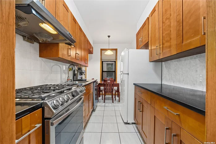 Discover this rare gem: a spacious and bright 2-bedroom co-op corner unit in the highly sought-after area of Flushing.  The Apt was fully gut renovated in 2012 and well maintained. The eat-in kitchen features a vented design and includes a dishwasher. The stove and window frames were updated 1-2 years ago. Plenty of closets and abundant windows fill the apartment with natural light.  With low maintenance fees that include heat and hot water, this meticulously maintained apartment offers exceptional value.  Sublease permitted after 2 years of ownership. Close to the 7 train, LIRR, shops, buses, and easy access to major highways. Convenient to all. Board approval is required.