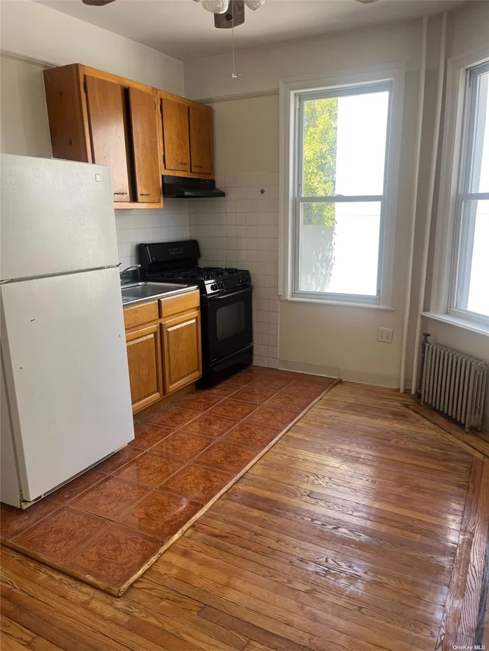 This spacious rental boasts a comfortable bedroom, full bathroom, inviting eat-in kitchen, cozy living room, ample closet space, and hardwood floors throughout. Enjoy abundant natural light from windows all around and stay cool with AC wall units. Located just across from Astoria Park, this apartment offers a picturesque setting and includes all utilities in the rent. Cats are welcome, making this an ideal choice for convenient city living.