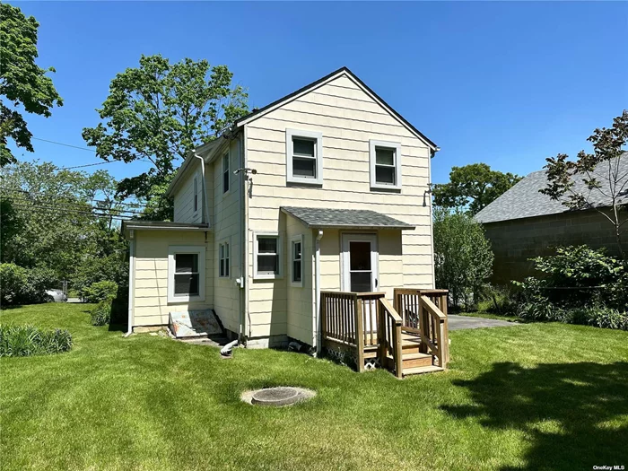 Welcome to the heart of the North Fork in desirable Mattituck! This 3br/1.5 bath two story home sits on a 0.12 acre lot. Features a newer roof (2022), newer windows (2019), newer furnace (2022), newer back deck, wood floors. The front porch and other rustic details add to its charm and character. Ready for its new owner to add the touches needed to make it their own. Close to town, park, school, wineries, shops and transportation. Walking distance to Love Lane! Offered as an As Is sale. Seller motivated! Zoned as Light Industrial