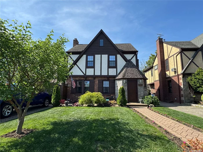 Perfectly Maintained Tudor with 3 Bedrooms + Bonus Room, 2 Full updated Baths, Hardwood Floors, Beautifully Paved Property, w/ in-Ground Pool !!! Property is MINT!!! Golf Simulator & 2 Car detached Garage Fenced in property with extra extra parking !!!