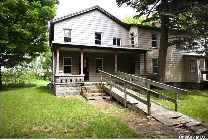 Large Property nestled at the end of the block. The property is located near farms and railroad tracks. 2.90 acres, the home needs some TLC. Come and make this gem yours. This home is close to Pennsylvania borders.
