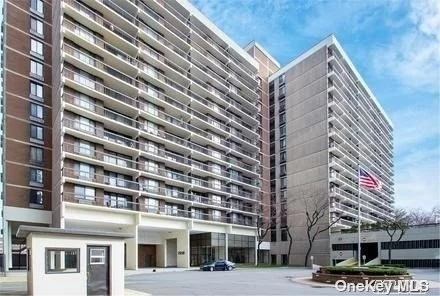 One of a kind large One Bedroom Unit with Huge balcony high floor endless views in the Village Mall at Hillcrest Condo!!! Location, Location, Location. 5 Star services of this gem includes: 24 hours doorman/concierge, indoor assigned parking spot, GYM, Pool, community/party room, BBQ&rsquo;s with picnic tables- are all included in a super low common charges. Laundry on each floor, gated promenade with state of the art landscaping and children playground. Express Busses to Manhattan, queens hospital, St Johns University, Dinning, shopping, are all surrounds Village Mall for your immediate convenience .