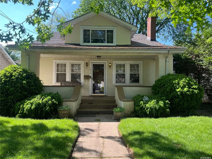 Welcome to a charming four-bedroom Cape-style home nestled in school district 14 Hewlett Woodmere, situated on a tranquil private dead-end street. Upon entry, you are greeted by a cozy living room adorned with a wood-burning fireplace. The main level also features a den, a full bathroom, a bedroom, and a well-appointed eat-in kitchen equipped with modern amenities including a dishwasher, electric stove, microwave, and refrigerator, complemented by a formal dining room perfect for entertaining. Hardwood floors grace the interior, alongside the convenience of an alarm system for added security. Upstairs, discover three additional bedrooms, a full bathroom, and a convenient laundry room. The finished basement offers ample storage space, complete with a cedar closet and utilities. Outside, a one-car detached garage and 200 amp service for electric provide practicality, gas line in the home for easy conversion while the spacious and secluded backyard offers a peaceful retreat. This prime location offers easy access to schools, shopping centers, transportation options, restaurants, and places of worship, making it an ideal place to call home..