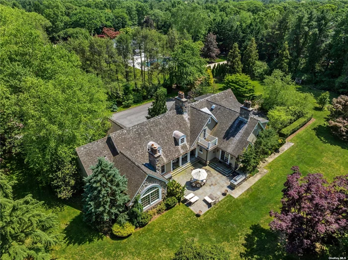 This spectacular stone and shingle Hampton style home is situated on over 2 acres of pristine property in the prestigious Village of Old Westbury. The home boasts a grand foyer, high ceilings, 4 fireplaces and handsome moldings. The chef&rsquo;s eat-in-kitchen features a large island, top of the line appliances and a light flooded breakfast area. The expansive living room is lined with is oversized windows, the formal dining room is substantial and a beautifully appointed mahogany office. The primary bedroom features his/hers walk-in-closets, a primary bathroom with steam shower, jacuzzi tub and two commodes. The first floor is rounded out by a formal powder room, an additional bedroom and another full bathroom. The lower level includes a wine cellar, entertainment space, gym, a bedroom and two full bathrooms.