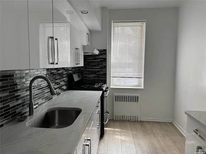 Welcome Home to this large 2-BR/Jr.4 Apartment with an indoor Parking Spot included in the Gorgeous VermontCo-op. Fully Renovated Eat-In Kitchen, Sun-Filled Living Room, Master Bedroom is a King Sized, Updated Windowed Bathroom with Stand-In Shower, Total of 5 closets .Co-pp Board approval required. Building Set Within a Gated Courtyard With Gardens & Seating Area For Residents To Enjoy. Residents Enjoy Outdoor Space in The Private Garden. Other Amenities Include An Updated Laundry Room,  In Close Proximity To Parks, Shops, Restaurants, And Much More. This Coop Is Not Pet Friendly.