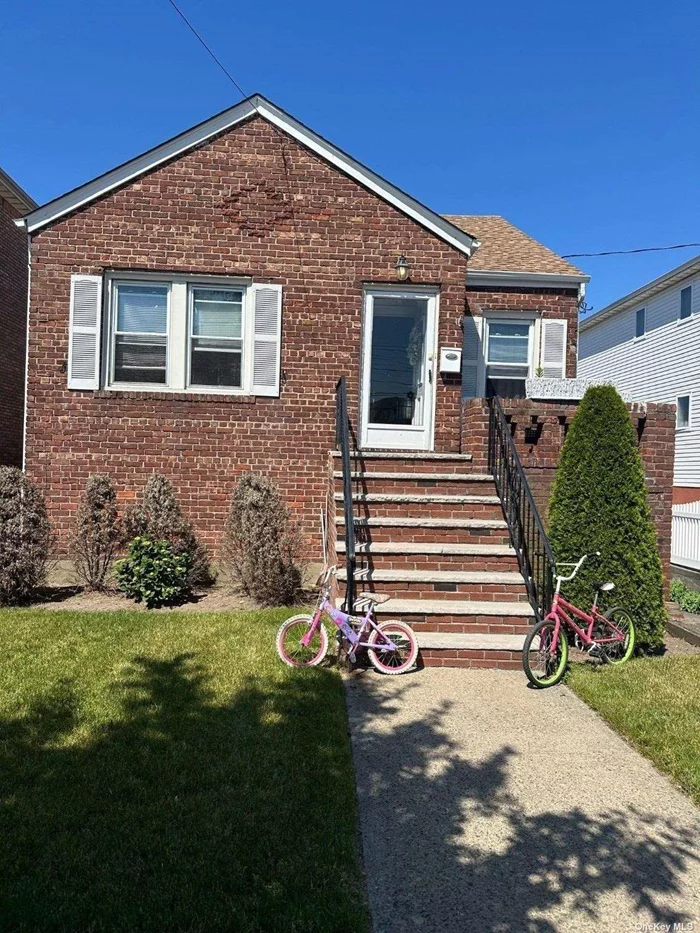 Charming Raised cape nestled in Old Howard Beach. Three bedrooms, two full bathrooms, private drive, one-car garage, and large yard for outdoor activities. The first floor was renovated in 2013 and can be dormered out to make more living space.