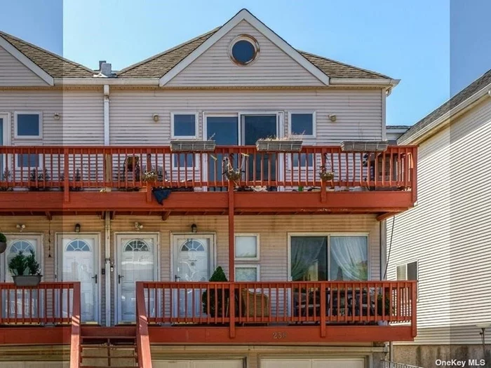 Great opportunity for individual or investor to live and rent 1 block from the ocean. Large 2 family. Each unit has 3 bedrooms, 2 full baths, open floor plan kitchen and living room, laundry, utility, CAC, 1 car garage and 1 car driveway. Lower unit has front terrace and walk out basement to rear yard. Upper unit has terrace off back with ocean views. Plenty of public parking on E Broadway.