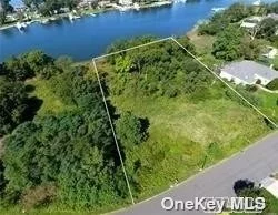 Now is the time to build your dream home on this magnificent waterfront lot on Old Neck Creek in Center Moriches, Long Island, New York. Imagine a peaceful retreat (located on a cul de sac) where you can escape the hustle and bustle of everyday life and immerse yourself in the tranquility of waterfront living while being a stones throw to everything Center Moriches has to offer or a quick drive to the fun in the sun Hamptons. Board of Health Approved, DEC for house and dock pending, sanitation design and house renderings available upon request. On this just shy acre property enjoy amazing sunsets and easy access out to Moriches Bay.
