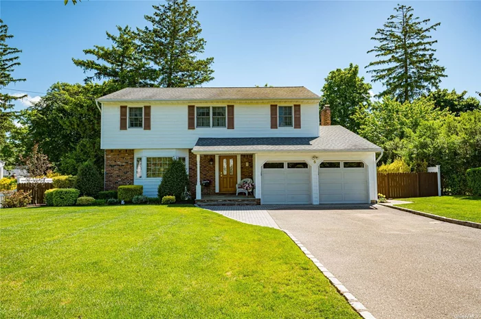 Move right into this charming 4BR, 2.5BA colonial located on a quiet tree-lined street in Smithtown Schools! Flooded with sunlight, this home boasts an updated kitchen w custom cabinetry, SS appliances and granite. Hardwood floors flow seamlessly throughout entire home (including under carpet)! The cozy den with custom woodwork mouldings has a gas fireplace and opens up to a large deck and charming backyard and is perfect for entertaning.3 year old gas burner, Andersen windows and roof 2012. Room for pool. Incredibly maintained!
