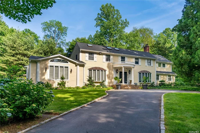 Prepared to be impressed upon entering this -4000sqft Colonial located in the prestigious Village of Laurel Hollow/Cold Spring Harbor School District. Greeted by foyer leading to living room with adjoining dining room and family room featuring vaulted ceilings and hardwood floors, creating one expansive entertaining space. Eat-in kitchen with custom cabinetry, two dishwashers, Wolf double wall oven, wine fridge, built-in breakfast nook, radiant floor heat and glass sliders to rear patio. Library with built-ins, desk, and fireplace. Guest bedroom, full bathroom, laundry and access to 3 car garage with custom built-in storage complete the first level. Second level encompasses 4 bedrooms include 1 en-suite and primary en-suite bedroom wing with office, walk-in closets, and luxurious bathroom with radiant floor heat. Basement provides storage and potential recreation space. Situated on 2 acres surrounded by mature trees for privacy, flower gardens, circular driveway, large rear patio with built-in Viking grill, and sprawling lawn with room for a pool. Convenient to Cold Spring Harbor/Huntington Villages with parks, restaurants, shopping, library, and hiking trails. Nearby Caumsett State Park and Laurel Hollow Village beach (dues) with mooring rights and kayak storage. Just 4.5 miles to L.I.E./Northern State Pkwy, 30 miles to the Midtown tunnel, and 2.5 miles to train station with direct lines to Grand Central and Penn Stations. Generac generator. Total Taxes $36, 376/yr
