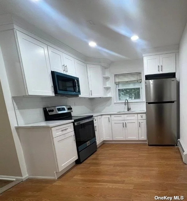 Freshly Painted Ground Level Two Bedroom Apartment With FULL BACKYARD In The Highly Desirable Half Hollow Hills SD, Everything Included & Brand New Kitchen