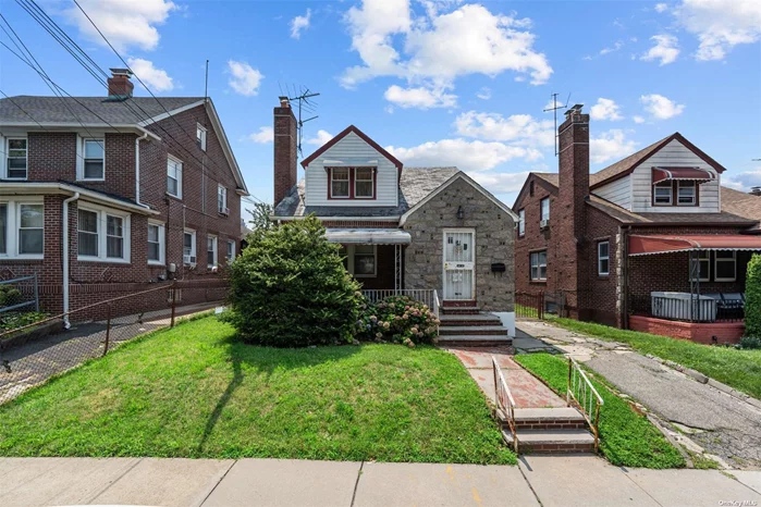 This brick two-family home is centrally located in St. Albans, Queens. It features 2-3 bedrooms on the first floor, 1-2 bedrooms on the second floor, and a very large basement.