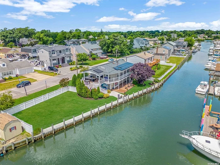 All Aboard!! Pristine Waterfront Canal with 136&rsquo; Of Navy Bulkheading. Custom Eat In Kitchen Is Every Chef&rsquo;s Envy With Wolf Stove, Granite Counters, Microwave Drawer & Paneled Refrigerator. Andersen Sliders Lead to Covered Multilevel Trex Decking For All Of Your Outdoor Entertaining With Bay Views. Radiant Heat Beneath Brazilian Cherry Hardwood Flooring. King Size Primary Bedroom With Custom Details Including Coffered Ceiling & Sliders To Balcony To Watch The Sunrise. Professionally Landscaped Property w/Perennials & 6 Zone IGS. Lower Levels Offer Large Den w/ Wet Bar, Queen Sized Bedroom & Custom Bath with Spa Shower. Energy Efficient Sunrun Solar Panels ( $240/mo) To Be Assumed By Purchaser. AE Flood Zone/Insurance Approx $5K/Yr. True Taxes Shown. This Home Checks So Many Boxes. Check It Out, It&rsquo;s More Than A Home, It&rsquo;s A Lifestyle.