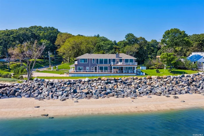 DIAMOND WATERFRONT, CUSTOM BUILT AND THE BEST VIEW IN TOWN! Most water frontage in Asharoken aside from the Morgan Estate. 4, 000 sq.ft Contemporary with approx. 220 ft of private sandy beach along the Long Island Sound. Dramatic unobstructed 180 degree waterviews from almost every room of the house. Boulder rock bulkhead. Open concept floor plan. Large open kitchen with custom built-table with a built-in wine storage, large island, and gas range top with downdraft hood vent. Custom closets with pocket doors through-out. Huge ensuite master bedroom with 2 private decks. Master bathroom features a huge walk-in shower, a freestanding copper bathtub and a water closet. Master bedroom closet has tons of built-in draws, closets and a roll out vanity bench. Perfect for keeping everything organized. Separate guest quarters. Pella windows thru-out; dramatic 9 ft and 10 ft ceilings, 5 individual Trex decks. Custom maple cabinetry and moulding thru-out. 2 gas fireplaces (one is indoor/outdoor). Open floating staircase. Guest quarters. Walk-out basement with custom barn doors and polished epoxy flooring leading to the two car garage. Brand new septic system, new paved driveway and walks. Large lawn. New landscaping stones. Full house generator. Flood insurance not required. Perfect place to call home and feel like you are on vacation every day!