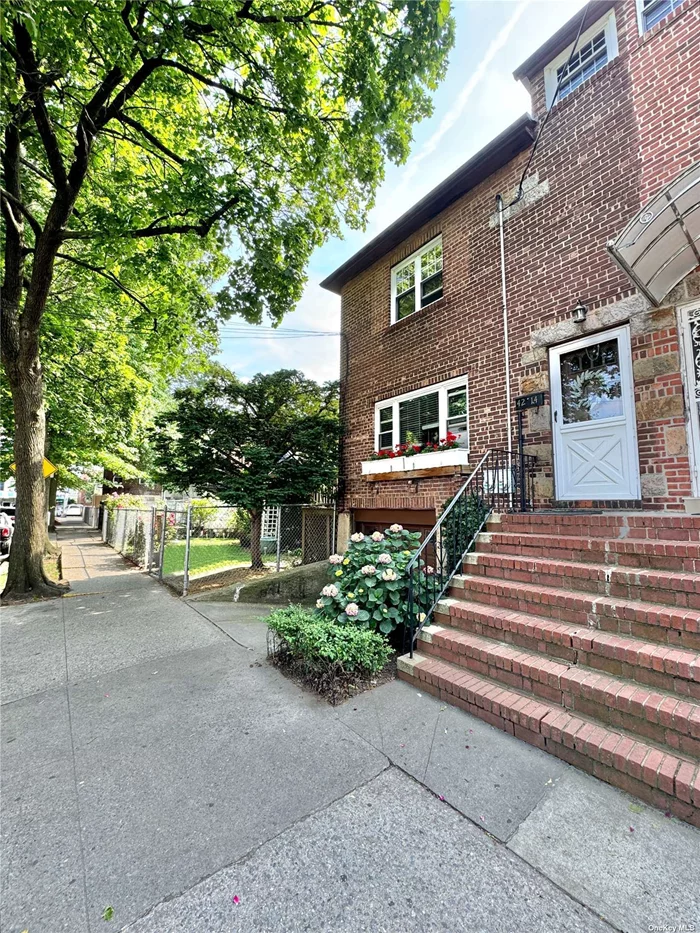 **BRING YOUR BUYERS!** Sitting on a Massive 64.67x95.25 Sq Ft Lot, this large sundrenched 2 family semi-detached brick townhouse (20x45 Sq Ft) in Elmhurst, Queens features 4 beds, 2.5 baths, 9 Ft ceilings, a partial unfinished attic, a full unfinished basement with separate outside side entrance, and hardwood floors throughout. Outdoor elements include your very own private driveway and car garage, side deck to the first floor, and a spacious side and backyards for all your bbqs and family gatherings. Zoning is R5. Great location and close to public transportation. *All information provided is deemed reliable but not guaranteed. Buyer must perform own due diligence*