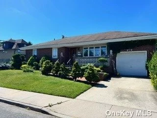 All brick home located on East Elmont cover Avenue school , beautiful porcelain floors , Exceptional private large back yard , many more extras to mention !!