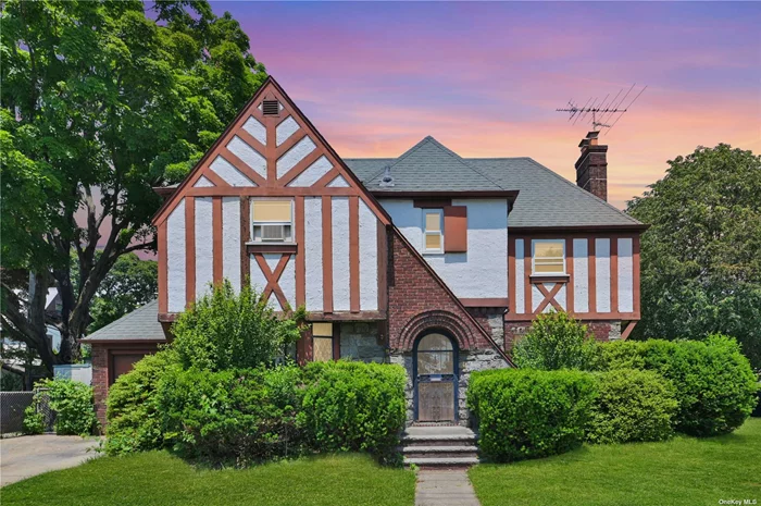 Charming & Full Of Character Custom Designed Tudor In Desirable Mineola. This Timeless Treasure Features Hardwood Floors, High Cove Ceilings & Many Original Details Throughout Including Solid Wood Doors. Past An Inviting Foyer Is An Elegant Living Room W/ A Wood-Burning Fireplace Flanked By Gorgeous Built-In Shelving & A Sunny Window W/ Classic Diamond Mullion Detail. A Spacious Formal Dining Room W/ Bay Window Flows Into A Generous Kitchen W/ Wood Cabinetry & A Discreet Powder Room Tucked Into The Corner. All Three Bedrooms Are On The Second Level, Including An Oversized Primary W/ Two Closets & A Full Bath W/ Separate Tub & Shower Stall Is In The Hall. The Walk-Up Attic Provides Additional Room For An Office Or Storage, While The Finished Basement Offers A Large Space Ideal As A Rec Room, Plus Laundry & Utilities. With A 1-Car Attached Garage This Home Is Perfectly Situated, Enjoy The Convenience Of Nearby Amenities, Including The LIRR & NYU Langone. Pre-Approvals Are Essential For All Showings.