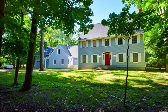 Built in 1993, this wonderful Cedar Clapboard Colonial sits on 1.31 acres on Beaver Dam Rd in the Hamlet of Brookhaven. Great for year round living or as a weekend getaway, this 4 bedroom home features a formal living room with fireplace, large open concept eat-in kitchen overlooking the family room, formal dining room, laundry/utility room, and powder room on the main floor. The bonus is what was once a private, sound proofed, office space with separate entrance. The space includes a large room, waiting area, and powder room that is plumbed for a shower. This would make a lovely guest, primary suite, or Nanny space. Upstairs you find the primary suite (bathroom needs love), and 3 guest bedrooms with full bath. The most amazing 2 story high porch with deck overlooking the back yard are perfect for barbequing and outdoor entertaining.  A 2 car attached garage, full unfinished basement with high ceilings, and plenty of attic space are perfect for all of your storage. Discover how this Brookhaven gem can become your treasured escape from the city&rsquo;s clamor. Convenient Location: Just a 1.25-hour drive from Manhattan, your serene getaway is closer than you think. The home is in close proximity to protected Carmen&rsquo;s River, the HOG Organic Farm and Trails, the Brookhaven Free Library, & the Post Morrow Foundation Headquarters with boardwalk on Beaver Dam Creek and interactive walking trails. Boat/Docking rights at Squassux Landing. Bellport Village is just 2 miles West
