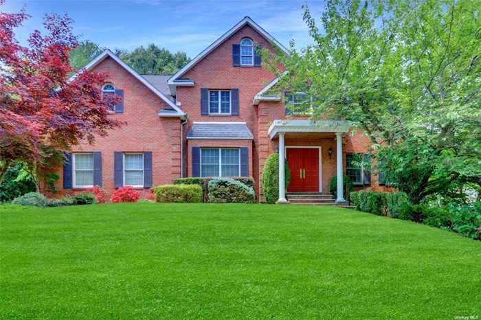 A Customized Residence for Optimal Privacy and Safety in Roslyn. This customized Brick Colonial is located in the Village of Rosly, and close to the beautiful Village shops and restaurants. The house features a grand 2-story entry foyer leading to the living room, formal dining room, large Eat-in kitchen w/granite countertops, family room w/fireplace, wet bar & built-in wall unit, office, laundry room, and powder room which complete the main floor. The second floor offers a primary bedroom w/ primary bathroom which features a Jacuzzi bathtub, showering room, and stool room; the second bedroom w/full bath, plus 2 additional bedrooms w/ a Jack and Jill bathroom, and bonus room perfect for night entertaining. The finished basement offers high ceilings, an above-ground guest suite, a gym, a family theater, a half bathroom, and a storage room. Other features include hardwood floors, 3-zone heating, 2-zone CAC, full house Generator, full house stereo system, an attached 2-car Garage, a huge deck with a retractable awning, and a sauna room.