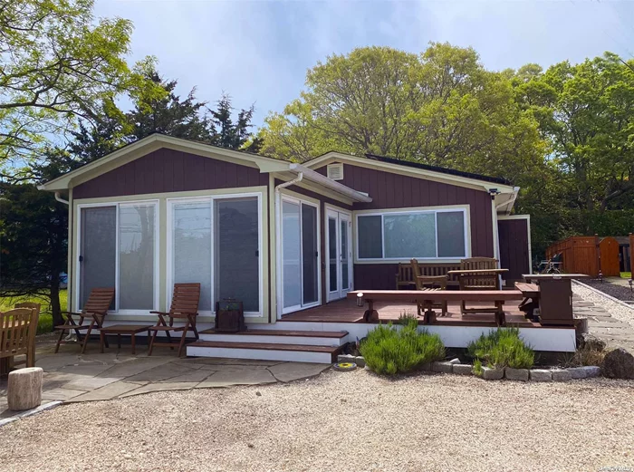 Beautiful 3 bedroom home just a block away from the beach. This home features an outside shower and fire pit. The screened in porch with a hot tub is a bonus.