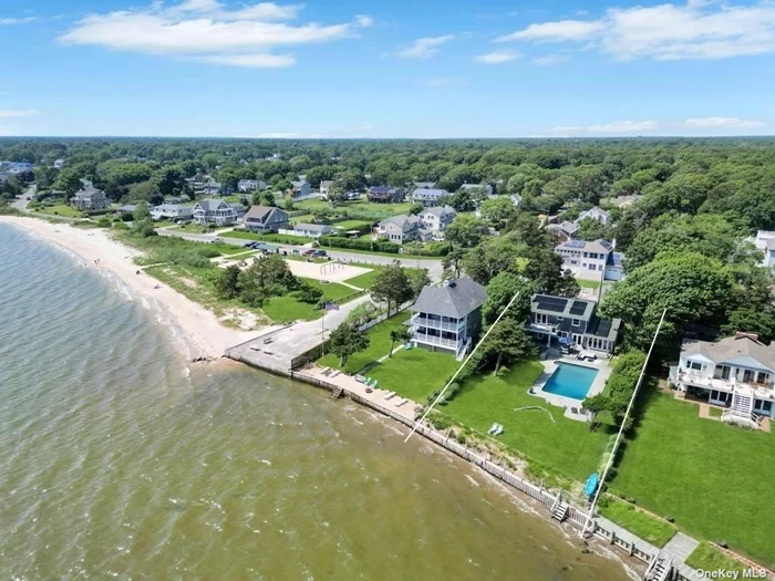 Experience the charm of Nantucket-stye living in this cedar shake Bayfront home with breathtaking, unobstructed waterviews on the east end of Long Island. From the front entrance to every room, you&rsquo;ll be greeted by the serene beauty of the bay. This fully bulkheaded property with private stairs to the beachfront, features a stunning gunite pool, encircled by a tumbled bluestone patio, creating a perfect outdoor retreat. Renovated inside and out in 2008, this 4 bedroom, 2.5 bath home has hardwood floors throughout and includes an attached garage. Upon entering, you&rsquo;ll be welcomed by the water-views from the entry foyer, which leads into the living room with a masonry fireplace. The open kitchen boasts wall-to-wall windows, Italian Quartz counters, stainless steel appliances and a center island, while the dining area features two sets of glass French doors that bring the outdoors in. The mudroom/laundry room offers garage access, a glass exterior back door, and a convenient half bathroom for outdoor activities. A blend of tradition and modern style, the staircase leads to the second level where you&rsquo;ll find four bedrooms and two marbled bathrooms. The primary ensuite features a large glass French door opening to a mahogany deck, perfect for lounging and enjoying the beautiful yard and bay views. Located at the end of the block is the scenic Terrell River County Park. On the fringe of the Hamptons, this home offers a choice of schools, including Westhampton High School.