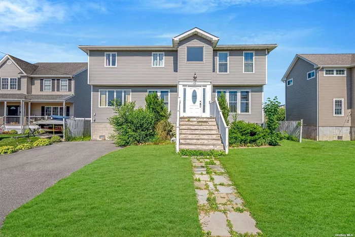 Welcome to 102 Surf Rd in Lindenhurst-a Stunning custom-built home from 2017 with breathtaking water views. This spectacular residence offers 4 spacious bedrooms and 3 full bathrooms. The open concept layout includes an HGTV kitchen with granite countertops and an eat-in kitchen. The primary bedroom features roomy closets, a soaking tub, and his-and-her sinks, complemented by a private balcony where you can enjoy your morning coffee while watching the boats go by. All bedrooms are generously sized, and the home boasts central air and ample closet space throughout. Highlights include hi-hats, abundant natural sunlight, and a convenient laundry room with a washer and dryer. Situated on a dead-end block with low traffic, this location is ideal for those seeking tranquility. Also perfect for boat lovers, the property is near marinas and docks, and it&rsquo;s approximately a short hour from New York City, with easy access to the train station and transportation. Located in the desirable Copiague school district, this home has natural gas and sewers, and is move-in ready. Once you come inside and sit on the couch you won&rsquo;t want to leave. It just feels right, it feels like HOME! Don&rsquo;t miss this incredible opportunity. Your dream home awaits!