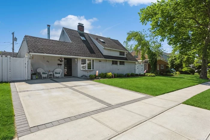 Move Right In to this Meticulous Home in the Heart of Salisbury. The amazing attention to detail makes this home stand out from all the rest. The first floor boasts a spectacular eat-in kitchen with lots of countertops, custom cabinets, recessed lighting, and a working fireplace open on two sides to the kitchen and living room. The kitchen leads to a spacious living room, sitting areas, a formal dining area, bedroom, full bath, and den. The sunlit den has skylights, opening to a private backyard with Ing. pool suited for entertaining. The second floor contains 2 bedrooms with generous custom built-in closets, a full bath with high end finishes. Laundry room is on the first floor and includes the heating. Indoor security system. The entire property is professionally landscaped and manicured with in-ground sprinklers. This unique property is close to Eisenhower Park, parkways, public transportation, shopping, schools, and all.