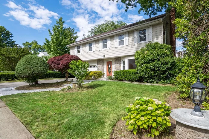 Westbury. Perfectly position on a lush and landscaped corner lot. Classic center hall colonial with open entry foyer, formal living room, formal dining room and den with fireplace. Large eat in kitchen granite counter tops and stainless steel appliances. Tile & hardwood floors throughout. First floor laundry with half bath and bedroom or office space. The second level features 3/4 bedrooms, including en suite primary and an additional full bath. Private and paved yard. Close proximity to all major roadways, shops, restaurants & transportation.