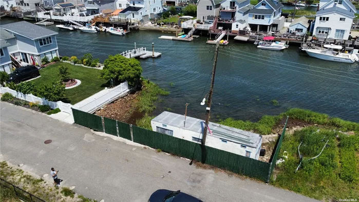Need to find your boat a home? This 50x100 waterfront vacant land is located on the 19th Road canal! Located near Sunset Cove in Broad Channel, Queens. This private oasis comes with the option to install a catwalk complete with a float, subject to approval by the Department of Environmental Conservation (DEC). To further sweeten the deal, owner financing is available, making this opportunity even more accessible and enticing.