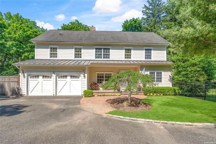 Welcome to this exceptional Upper Brookville Colonial, a timeless gem originally built in 1938 and thoughtfully extended and completely renovated in 2008. Despite the modern upgrades, the home retains its original charm, seamlessly blending classic elegance with contemporary comforts. Two Primary Suites: This home offers the luxury of two primary suites, one conveniently located on the main level and the other on the second floor, providing flexibility and comfort for multi-generational living or guest accommodations. The spacious Great room features soaring ceilings, creating an open and airy atmosphere. Large windows offer picturesque views of the lush, beautifully landscaped property, bringing the beauty of the outdoors inside. Throughout the home, you&rsquo;ll find meticulously renovated spaces that honor the original architecture while incorporating modern amenities and finishes. Hardwood floors, custom moldings, and high-end fixtures are just a few of the thoughtful details. Keeping up with modern needs, the home includes a car charging station, making it convenient for electric vehicle owners. The Chef&rsquo;s kitchen is equipped with state-of-the-art appliances, ample counter space, and custom cabinetry, perfect for preparing meals and entertaining guests. The outdoor entertainment area is an oasis designed for relaxation and fun. The in-ground saline vinyl pool offers a refreshing escape on hot summer days, surrounded by a beautifully landscaped patio. Extend your living space outdoors with an outdoor shower and a fully equipped outdoor kitchen, ideal for hosting summer barbecues and pool parties. The property is beautifully landscaped, providing a serene and private setting. Mature trees, flowering plants, and well-maintained lawns create a park-like atmosphere. This special home is a rare find, offering the perfect balance of historic charm and modern luxury.