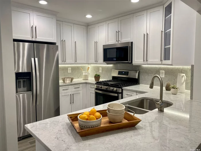 Ask About Our Outstanding Specials*; Shaker-style cabinets. Quartz ctrtop/backsplash/plank tile flr. Bath: frmls shwr drs/subway tile /quartz vanity. Hi-hats.Ceil fans.Whirlpool gold ser.SS Appl. WD.Gray paint/crpt. Central gas heat/air/Gym/Pool/Rt 495 x40/nr LIRR. Jericho schools #1 national-Niche survey. *May change w/o notice.