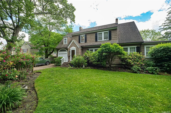 Beautiful, stately colonial in the prestigious Parkwood section. Formal living room with gas fireplace, formal dining room, oversized den with fireplace, eat-in kitchen, laundry room, 2.5 baths, 4 bedrooms, walk-up attic, back porch, built-in pool, and parklike grounds.