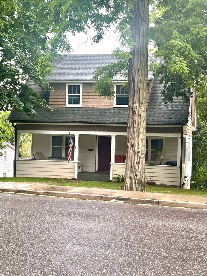 Recently renovated historic house with marina water views on iconic Woodbine Avenue in Northport Village. This two story home boasts large front porch and two enclosed summer porches on second floor in addition to two bedrooms. Separate exit from basement is partially finished and is ideal for office space.Accss to lagoon for kyacking and canoeing. Close to parks, village dock, Main Street restaurants, theater and retail shops.