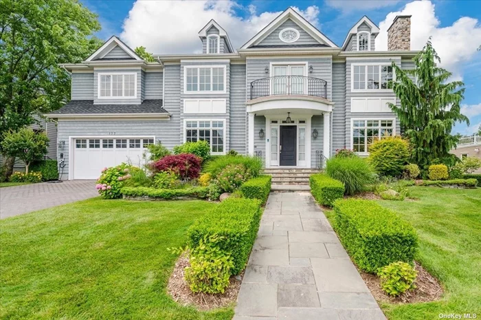 Welcome to this stunning center hall colonial, built in 2010, in the highly sought-after Sutton Park area of Lawrence. As you enter, you will immediately notice the magnificent sweeping staircase, custom coffered ceilings and grand scale of the rooms. In addition to the oversized formal DR, LR, spacious EIK and massive family room, there is also a butler&rsquo;s pantry, office, main floor guest room, 1.5 baths, garage, and a custom wine cellar for the wine enthusiast! The kitchen is a chef&rsquo;s dream, equipped with three GE Monogram ovens, a pot filler, warming drawer, two built-in microwaves and a new Sub-zero refrigerator/ freezer.  Upstairs features five x-large bedrooms, four bathrooms (3 en-suite), a laundry room and a chill space, which could be made into a sixth bedroom. The tiled floors all have radiant heat and there is a whole house water filtration system. Closet space abounds, each with a custom closet system. Additionally there is a walk-up attic for extra storage or potential living space.  The backyard is a tranquil oasis with magnificent landscaping, a screened-in porch (with retractable roof), built-in grill and sink, and a basketball court. Situated on .3 acre, the possibilities for the yard are endless. Quick walk to Far Rockaway through a passage at the end of the block; Atlantic Beach is a 5 minute drive, just over the bridge. Don&rsquo;t miss the opportunity to own this exceptional home in a distinctly prestigious neighborhood.