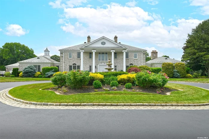 Located in a gated community in Upper Brookville, this 10, 000-square-foot majestic Gold Coast estate welcomes you with a circular driveway, soaring ceilings, and a grand double staircase. This luxurious home boasts a balcony on the second floor, a raised panel mahogany ceiling, and built-in cabinets and bookcases. It contains a Chef&rsquo;s custom eat-in kitchen with double all Wolf appliances. This Estate features six fireplaces. All bedrooms enjoy en suite baths. The Main bedroom has four closets and an en suite bath with a fireplace, jacuzzi, and an enormous walk-in shower. The main house has seven elegant bedrooms, nine full baths, and two half baths. For the car lover, there is a three-car garage attached to the main house and a nine-car detached garage with heat and air conditioning. Over the detached garage, there is an elegant one-bedroom apartment. The basement contains a state-of-the-art media room, a 1200-bottle wine cellar, perfect for the collector or investor, a humidor for the cigar smoker, a game room, and a gym for those who enjoy staying fit at home. The full-house generator ensures uninterrupted power for this five-acre estate. For all those who appreciate nature, this home enjoys a garden that contains a variety of unique trees, vegetable gardens, and marvelous sprawling lawns. The Olympic pool is complemented by a pool house, a one-bedroom guest cottage, two outdoor kitchens, and a travertine patio for dining. Summer fun can be enjoyed by playing tennis and basketball, visiting nearby beaches, and enjoying North Shore luxury and amenities. The seller is willing to hold the mortgage to a qualified buyer.