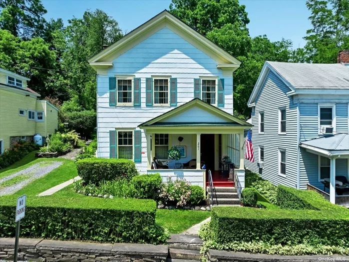 Escape the hustle of NYC to this charming Colonial home in Richmondville! Recently updated, this 4-bedroom, 2-bathroom property features a spacious eat-in kitchen with stainless steel appliances, a 40-inch stove, and a farmhouse sink. The original hardwood floors add character, while modern upgrades like a new furnace, roof, and hot water tank provide comfort. Enjoy the seasonal porches, bluestone patio, and a beautiful iron garden gate. Inside, high ceilings and a cozy fireplace with a pellet stove on a soapstone hearth create a warm, inviting atmosphere. The fenced-in yard offers privacy, and shops, dining, and major towns are just 40 minutes away.