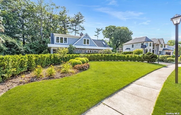 Charming Family Home with Modern upgrades in a prime location! Welcome to this stunning home for sale in the highly sought-after Country Club section of Roslyn Heights, perfectly situated on a picturesque, tree-lined street. This residence features a circular driveway and an open floor plan that boasts a living room with cathedral ceilings and a dual fireplace. Sunlight floods the home through numerous windows and skylights, creating a bright and inviting atmosphere. The kitchen is equipped with heated floors and a convenient laundry room with a new washer and dryer. Entertain in style in the spacious formal dining room. The main floor offers a primary bedroom with an en-suite bath and a custom walk-in closet. Set on over half an acre, the property includes a manicured backyard with beautiful landscaping. Recent upgrades include a 9-year-old roof, a new hot water heater, a new oven, new carpets, and upgraded electrical systems. Enjoy built-in speakers throughout the main level, plenty of closets, and ample storage space. The upper level features four large bedrooms and two baths. Located within the East Williston School District and just minutes from highways, this home offers exceptional curb appeal and convenience. Look no further-your dream home awaits! Taxes Have Never Been Grieved